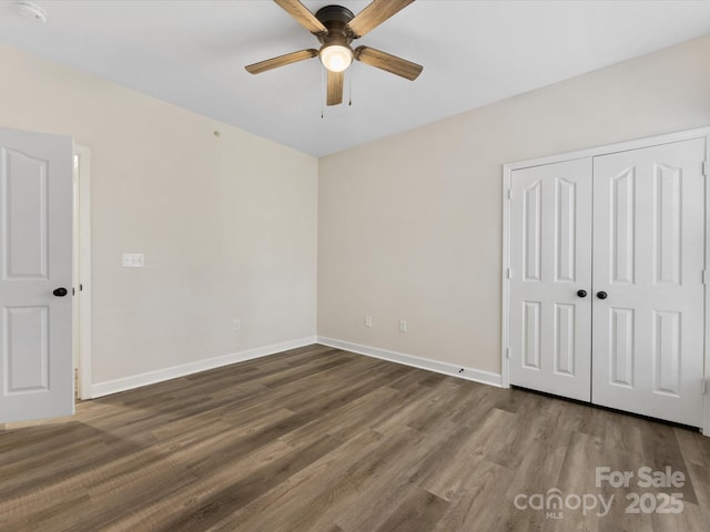 17136 Red Feather Dr, Charlotte, NC 28277 - unfurnished bedroom with wood finished floors, a closet, and ceiling fan