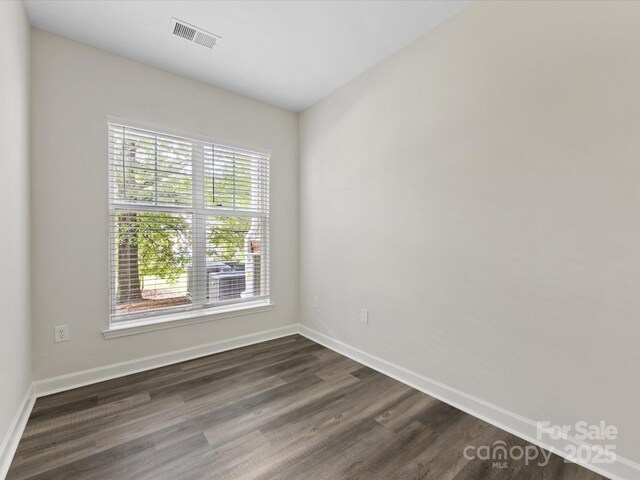 17136 Red Feather Dr, Charlotte, NC 28277 - empty room with dark wood-style flooring and baseboards