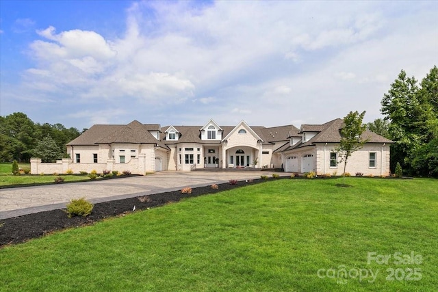 7068 Denison Rd, Summerfield, NC 27358 - view of front facade featuring a front lawn, stone siding, and driveway