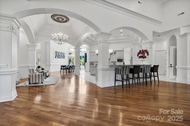 7068 Denison Rd, Summerfield, NC 27358 - foyer featuring light wood finished floors, crown molding, and a towering ceiling