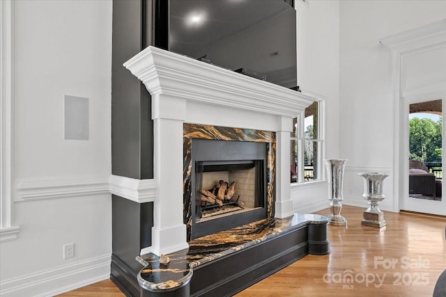 7068 Denison Rd, Summerfield, NC 27358 - detailed view of wood finished floors and a fireplace