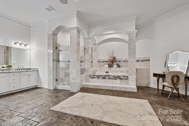7068 Denison Rd, Summerfield, NC 27358 - bathroom with decorative columns, a garden tub, vanity, a shower stall, and ornamental molding