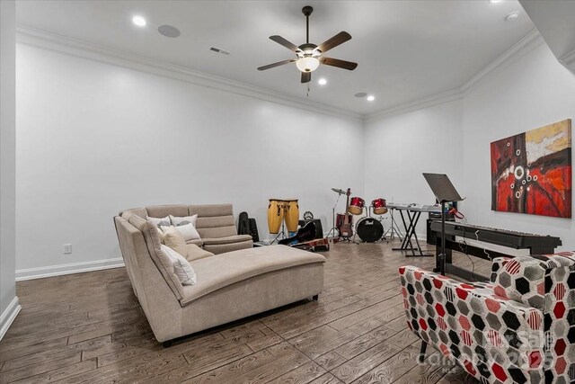 7068 Denison Rd, Summerfield, NC 27358 - living room featuring dark wood-style flooring, a ceiling fan, crown molding, and recessed lighting
