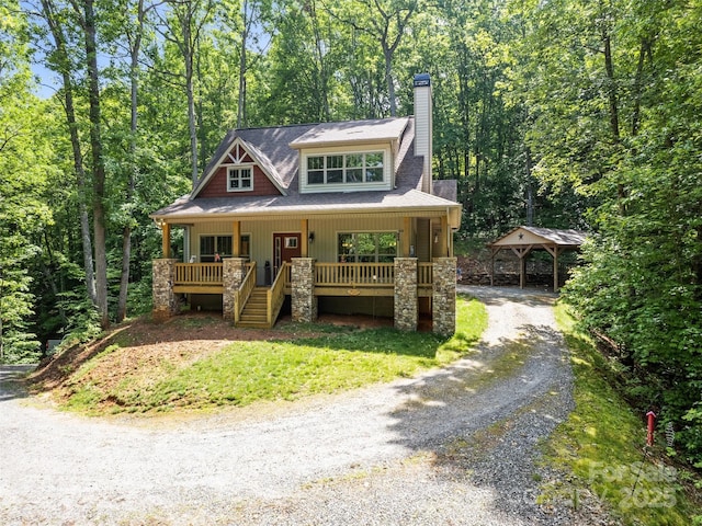 389 Manna Way, Sylva, NC 28779 - view of front facade featuring covered porch, dirt driveway, a chimney, stone siding, and stairs