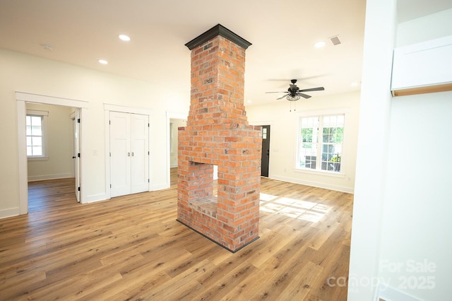 506 E Main St, Forest City, NC 28043 - unfurnished living room featuring decorative columns, light wood-type flooring, ceiling fan, plenty of natural light, and recessed lighting