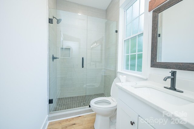 506 E Main St, Forest City, NC 28043 - full bathroom featuring vanity, a shower stall, and wood finished floors
