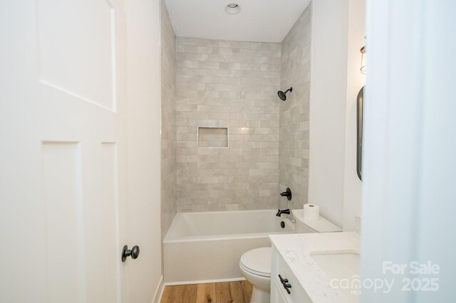 506 E Main St, Forest City, NC 28043 - full bath featuring vanity, bathing tub / shower combination, and wood finished floors