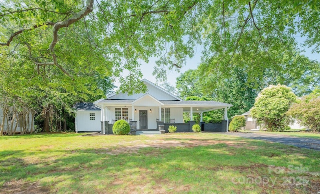 506 E Main St, Forest City, NC 28043 - view of front of property featuring covered porch, a front yard, and driveway