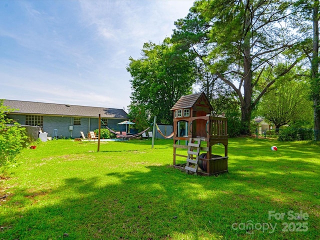 1035 Chesterfield Hwy, Cheraw, SC 29520 - view of grassy yard with a playground