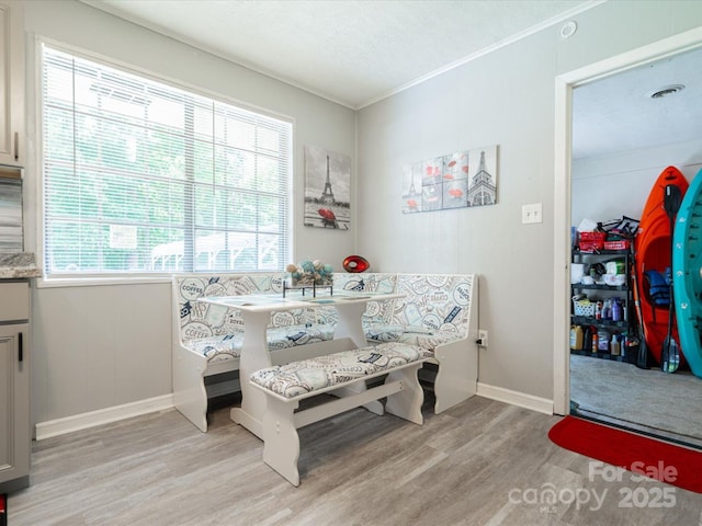 1035 Chesterfield Hwy, Cheraw, SC 29520 - dining room featuring light wood-style floors, crown molding, and breakfast area