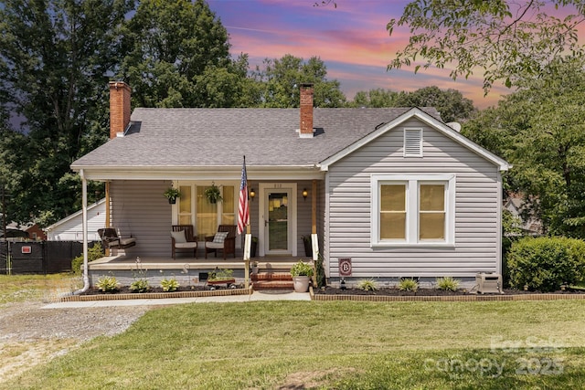 810 Maplewood Ave, Kannapolis, NC 28081 - view of front facade featuring a porch, a lawn, a chimney, and roof with shingles