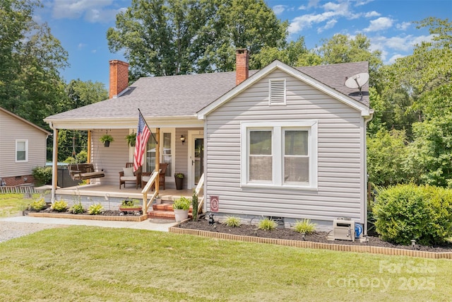 810 Maplewood Ave, Kannapolis, NC 28081 - view of front facade with a front yard, a chimney, covered porch, and a shingled roof
