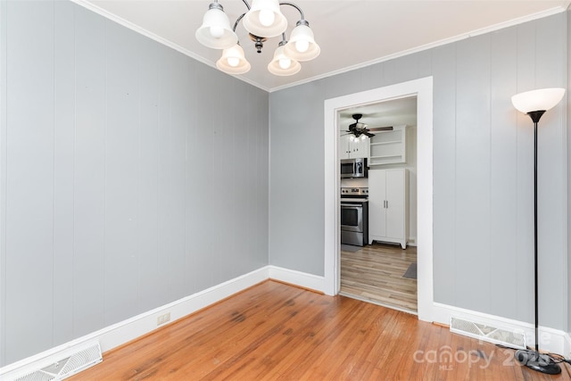 810 Maplewood Ave, Kannapolis, NC 28081 - empty room with a chandelier, light wood-style floors, crown molding, and a ceiling fan