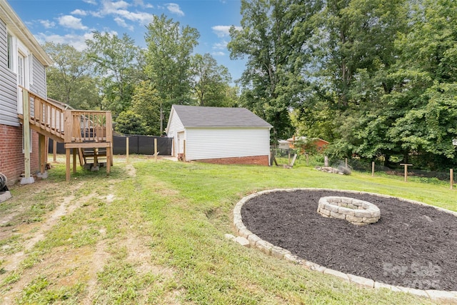 810 Maplewood Ave, Kannapolis, NC 28081 - view of yard with a fire pit, a wooden deck, an outbuilding, stairway, and view of scattered trees