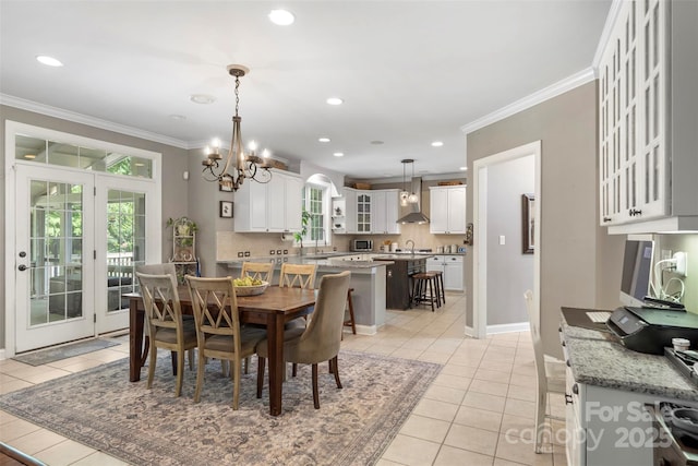 6006 Casswell Cir, Matthews, NC 28104 - dining room featuring crown molding, light tile patterned flooring, a chandelier, and recessed lighting