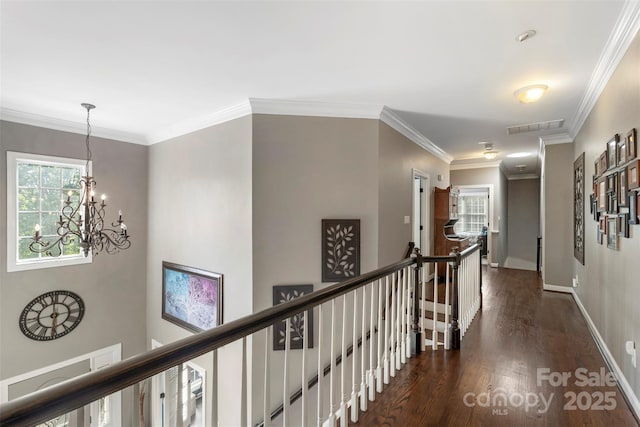 6006 Casswell Cir, Matthews, NC 28104 - corridor with an upstairs landing, dark wood-style floors, a chandelier, and ornamental molding