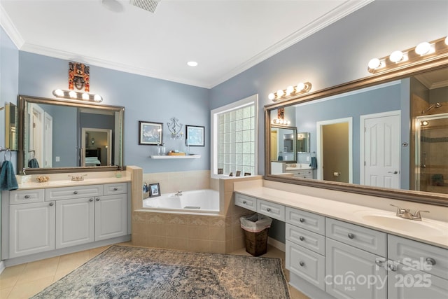 6006 Casswell Cir, Matthews, NC 28104 - full bathroom featuring tile patterned flooring, a shower stall, two vanities, a garden tub, and ornamental molding