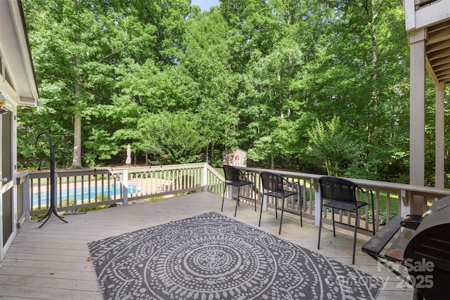 6006 Casswell Cir, Matthews, NC 28104 - wooden terrace featuring an outdoor pool and grilling area