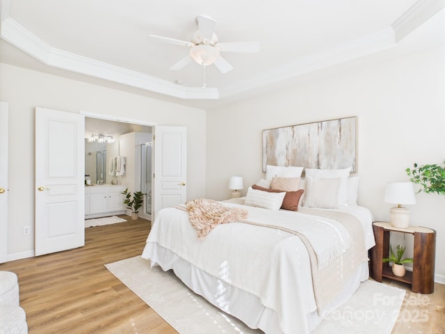 9030 Gander Dr, Charlotte, NC 28277 - bedroom featuring a raised ceiling, ornamental molding, light wood-type flooring, ensuite bathroom, and a ceiling fan