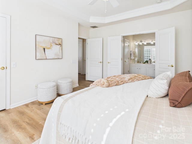 9030 Gander Dr, Charlotte, NC 28277 - bedroom featuring light wood finished floors, ensuite bath, crown molding, ceiling fan, and a raised ceiling