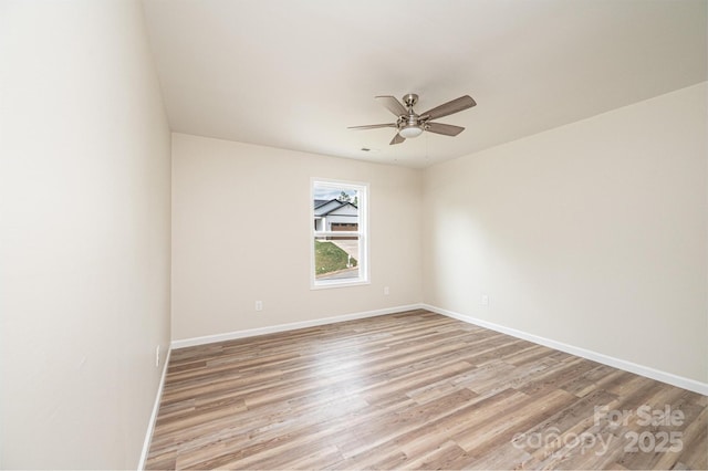 1214 Winter Pl SW, Lenoir, NC 28645 - spare room featuring a ceiling fan and light wood-style flooring