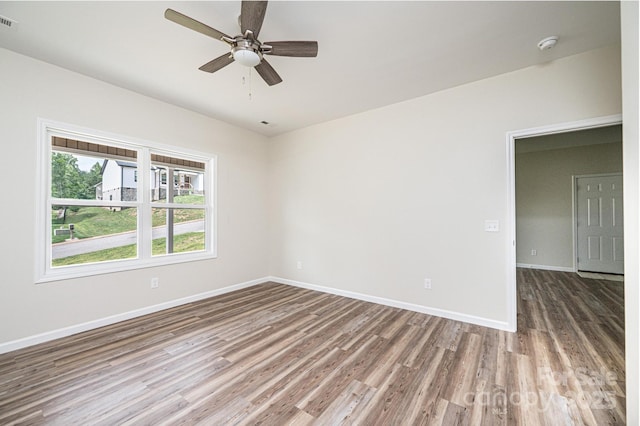 1214 Winter Pl SW, Lenoir, NC 28645 - spare room featuring wood finished floors, ceiling fan, and a smoke detector