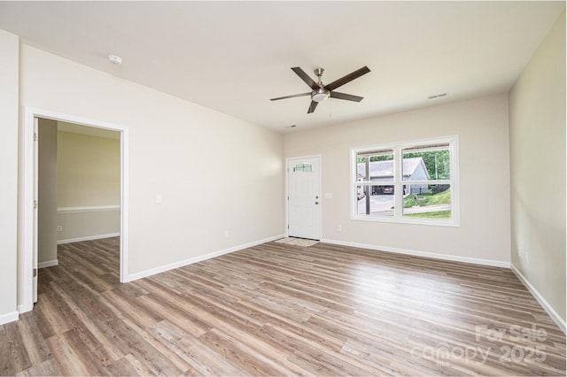1214 Winter Pl SW, Lenoir, NC 28645 - empty room with light wood finished floors and a ceiling fan