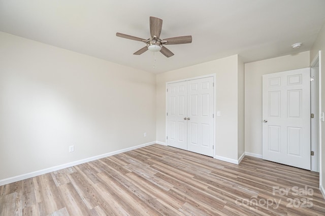 1214 Winter Pl SW, Lenoir, NC 28645 - unfurnished bedroom with light wood-style floors, a closet, and ceiling fan