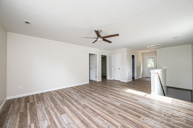 1214 Winter Pl SW, Lenoir, NC 28645 - empty room with wood finished floors, ceiling fan, and attic access