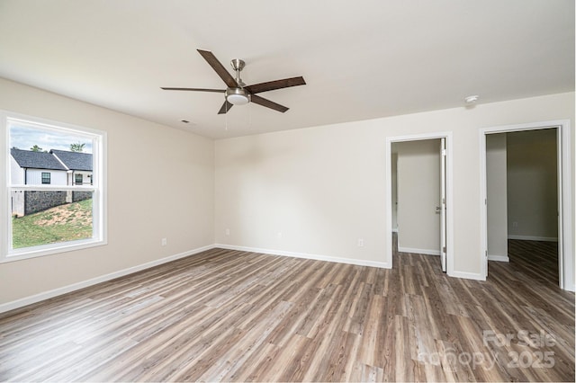 1214 Winter Pl SW, Lenoir, NC 28645 - spare room with wood finished floors and ceiling fan