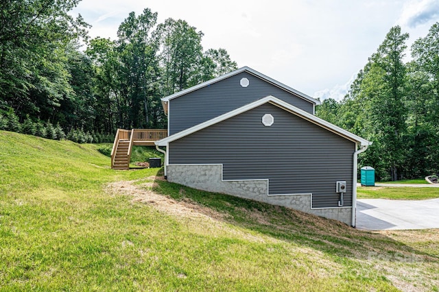 1214 Winter Pl SW, Lenoir, NC 28645 - view of home's exterior featuring stairway, a deck, and a lawn