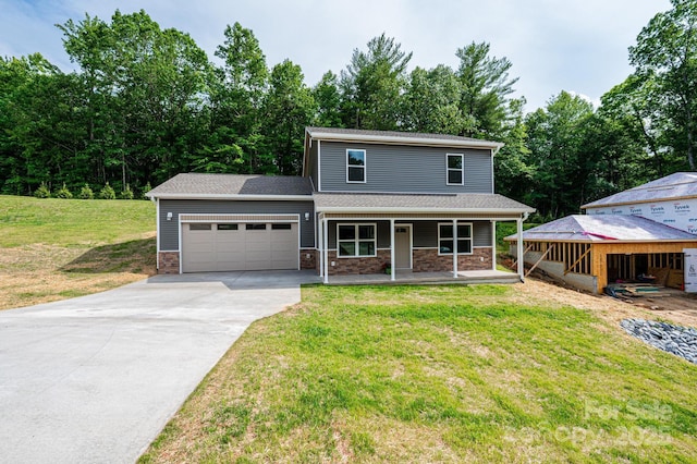 1214 Winter Pl SW, Lenoir, NC 28645 - traditional home with concrete driveway, an attached garage, a porch, and a front lawn