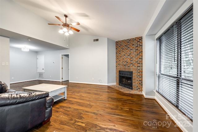 1606 Sharon Rd W Unit 40, Charlotte, NC 28210 - living room featuring a ceiling fan, a fireplace, wood finished floors, and high vaulted ceiling