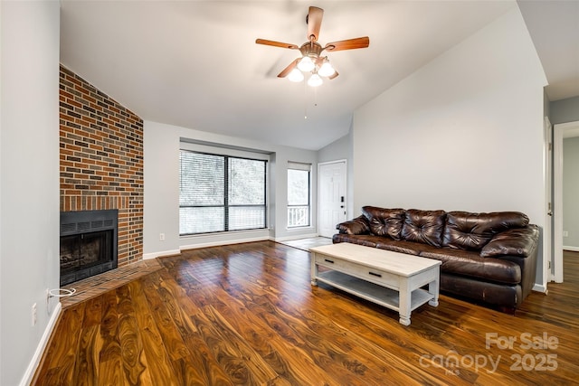 1606 Sharon Rd W Unit 40, Charlotte, NC 28210 - living room with vaulted ceiling, a ceiling fan, wood finished floors, and a fireplace