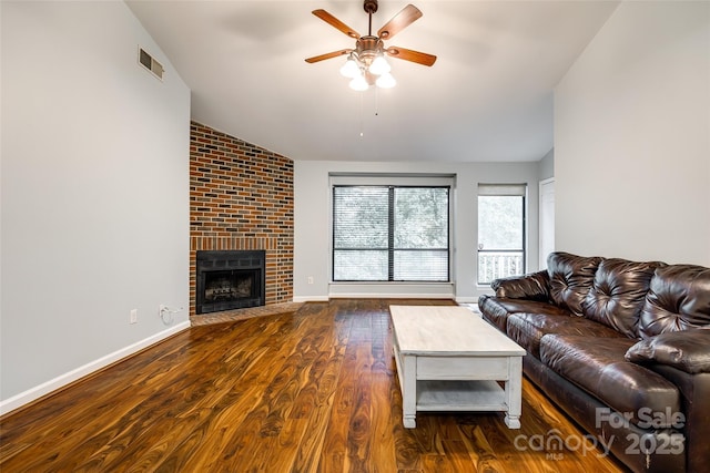 1606 Sharon Rd W Unit 40, Charlotte, NC 28210 - living area with ceiling fan, lofted ceiling, dark wood-type flooring, and a fireplace