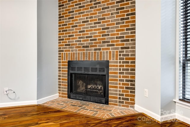 1606 Sharon Rd W Unit 40, Charlotte, NC 28210 - detailed view of wood finished floors and a fireplace