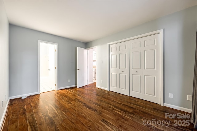 1606 Sharon Rd W Unit 40, Charlotte, NC 28210 - unfurnished bedroom featuring dark wood-style flooring and a closet