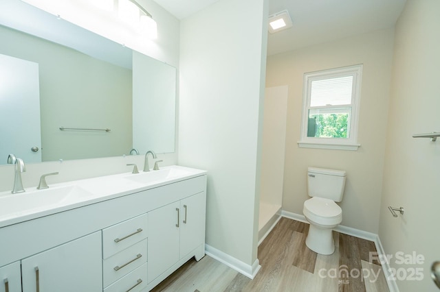 1696 Race Path Church Rd, Mooresboro, NC 28114 - bathroom featuring wood finished floors, double vanity, and a shower