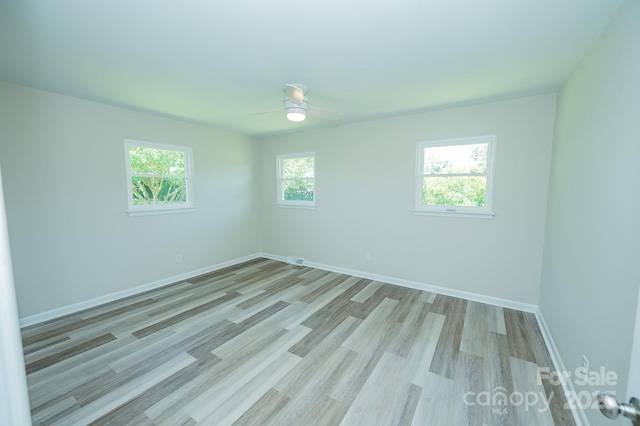 1696 Race Path Church Rd, Mooresboro, NC 28114 - empty room featuring light wood-style flooring and a ceiling fan