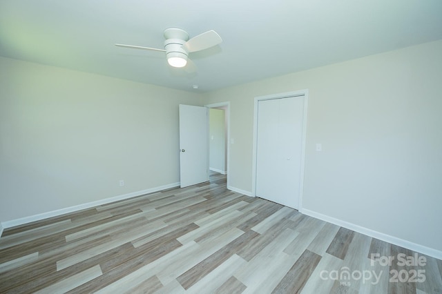 1696 Race Path Church Rd, Mooresboro, NC 28114 - unfurnished bedroom featuring wood finished floors, a closet, and ceiling fan