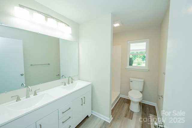 1696 Race Path Church Rd, Mooresboro, NC 28114 - full bathroom with wood finished floors, double vanity, and a shower