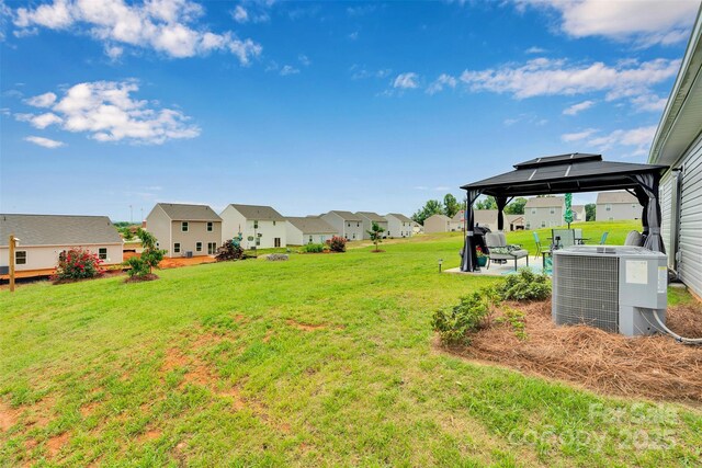 410 Apex Cir, Shelby, NC 28152 - view of grassy yard with a residential view, a gazebo, and a patio
