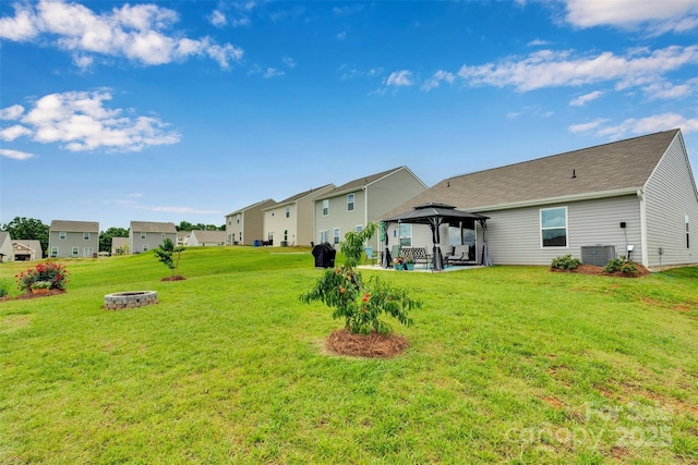410 Apex Cir, Shelby, NC 28152 - back of house featuring a gazebo, a fire pit, a lawn, a patio, and a residential view
