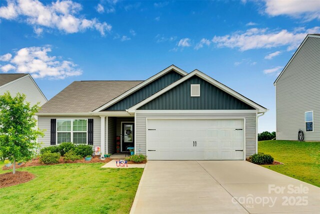 410 Apex Cir, Shelby, NC 28152 - view of front of property with board and batten siding, an attached garage, a front yard, and concrete driveway