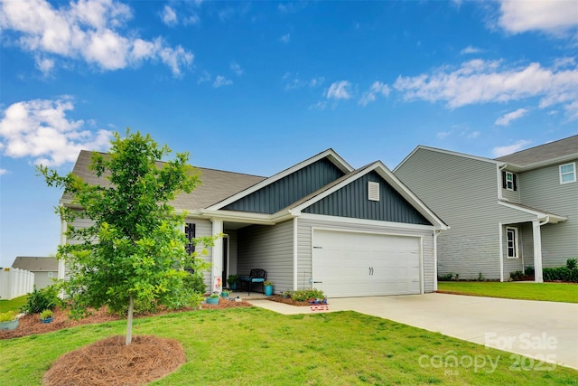 410 Apex Cir, Shelby, NC 28152 - view of front of home with board and batten siding, an attached garage, driveway, and a front yard