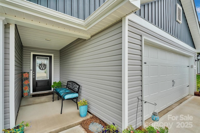 410 Apex Cir, Shelby, NC 28152 - view of exterior entry featuring board and batten siding and a garage