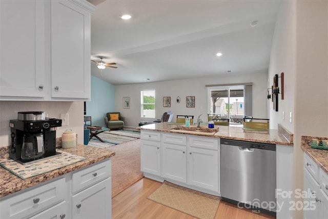 410 Apex Cir, Shelby, NC 28152 - kitchen with stainless steel dishwasher, light wood-style floors, a peninsula, ceiling fan, and open floor plan