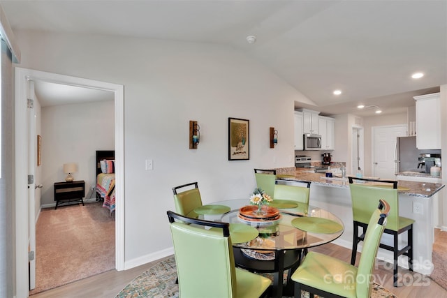 410 Apex Cir, Shelby, NC 28152 - dining space featuring lofted ceiling, light wood-type flooring, and recessed lighting