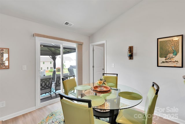 410 Apex Cir, Shelby, NC 28152 - dining space with light wood-style floors and vaulted ceiling
