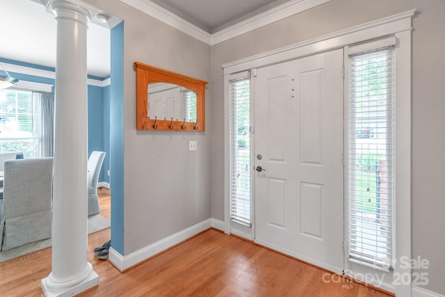 2619 Merion Hills Ct, Charlotte, NC 28269 - entrance foyer with decorative columns, crown molding, and light wood-type flooring